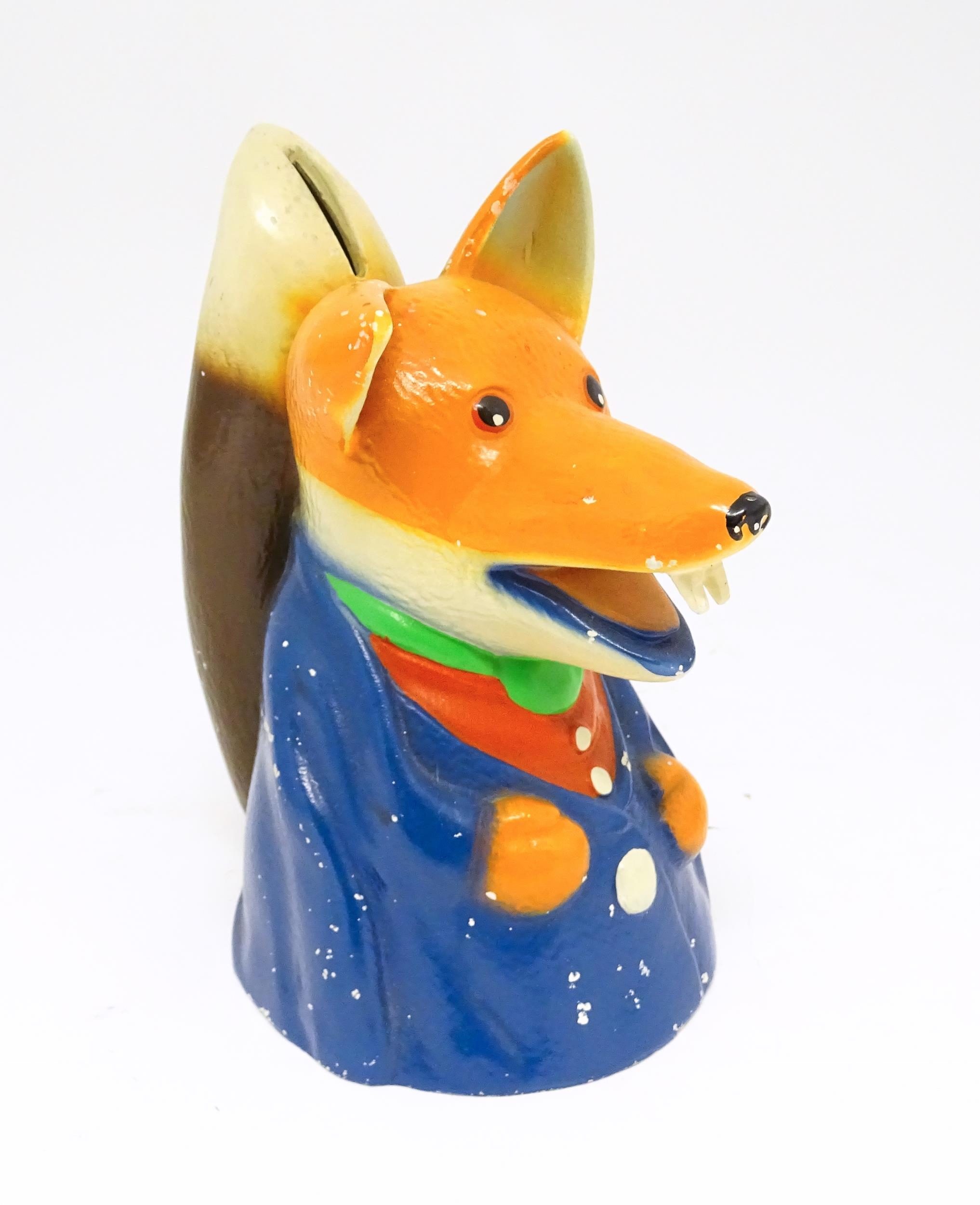 A 20thC novelty cast money box modelled as Basil Brush Ivan Owen & Peter Firmin. Approx. 8" high