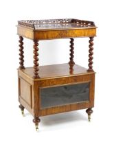 A late 19th century walnut whatnot / side cabinet surmounted by a pierced floral decorated