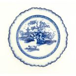 A Liverpool blue and white pearlware plate with feathered edge decorated with chinoiserie detail