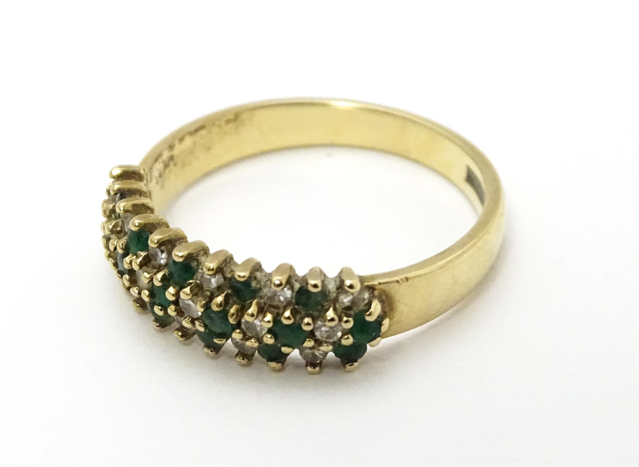 A 9ct gold ring set with emeralds and diamonds. Ring size approx. K Please Note - we do not make - Image 4 of 6