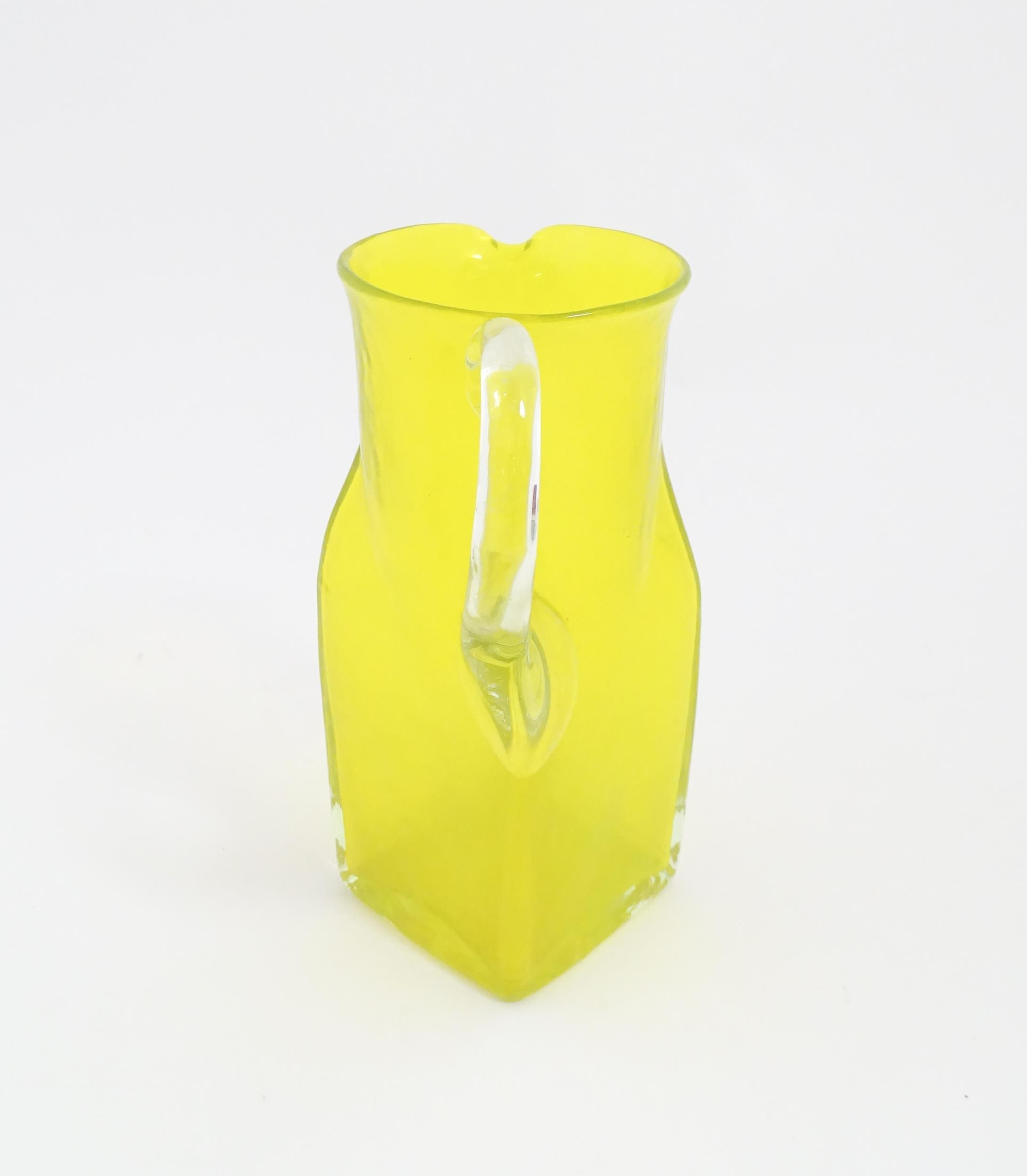 A 20thC yellow glass jug with squared base and clear glass handle. Approx. 8 1/2" high Please Note - - Image 6 of 11