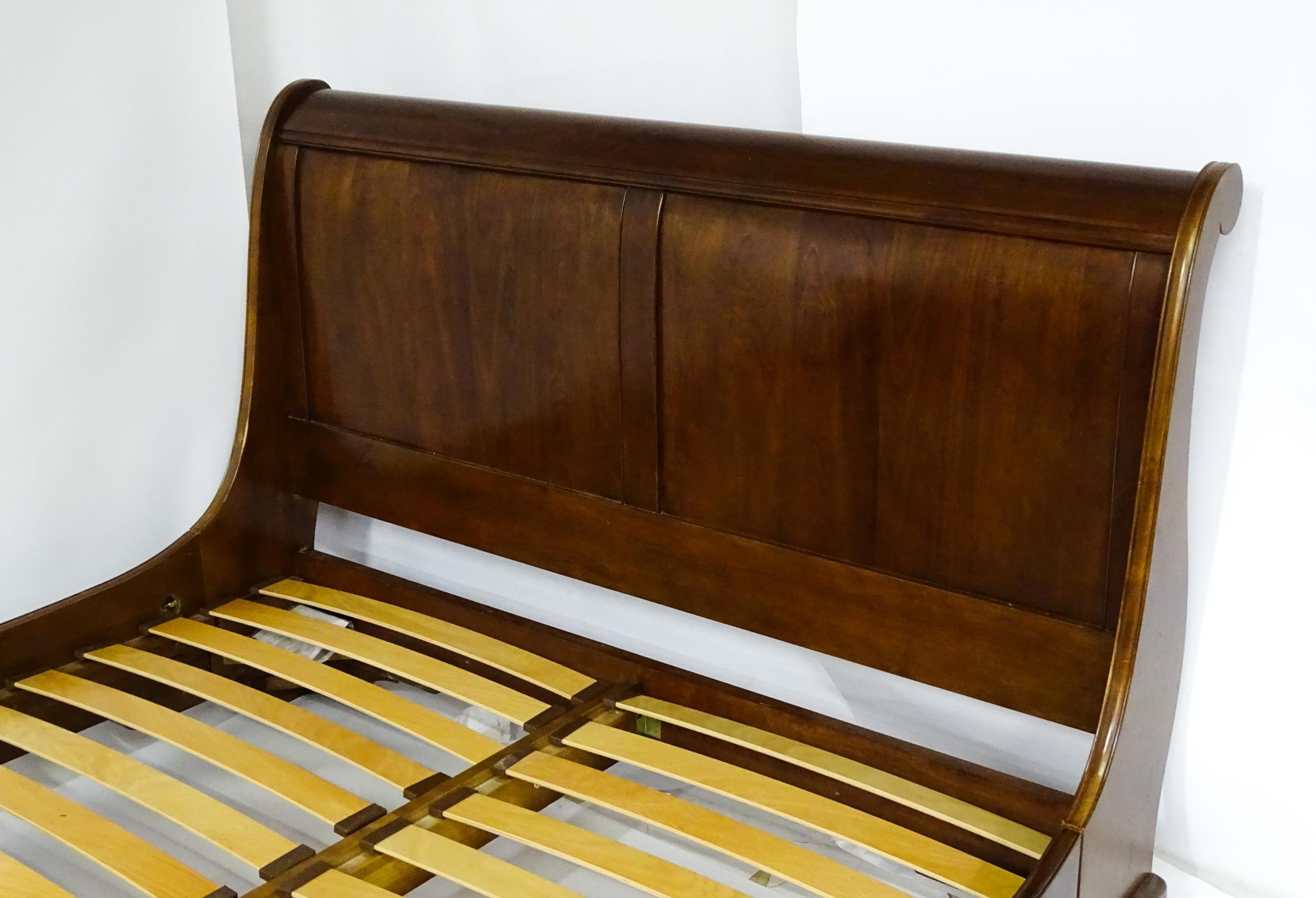 A modern mahogany sleigh bed. 6 1/2ft long x 5ft wide. Please Note - we do not make reference to the - Image 6 of 6