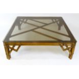 A late 20thC bamboo style glass topped coffee table. 48" wide x 48" deep x 15" high. Please Note -