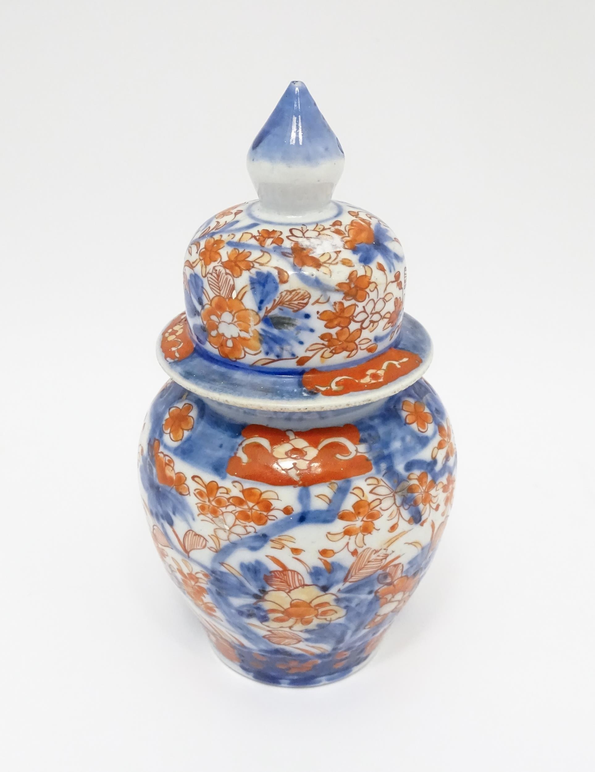 An Oriental ginger jar decorated in the Imari palette with flowers and foliage. Approx. 7 1/2" - Image 6 of 7