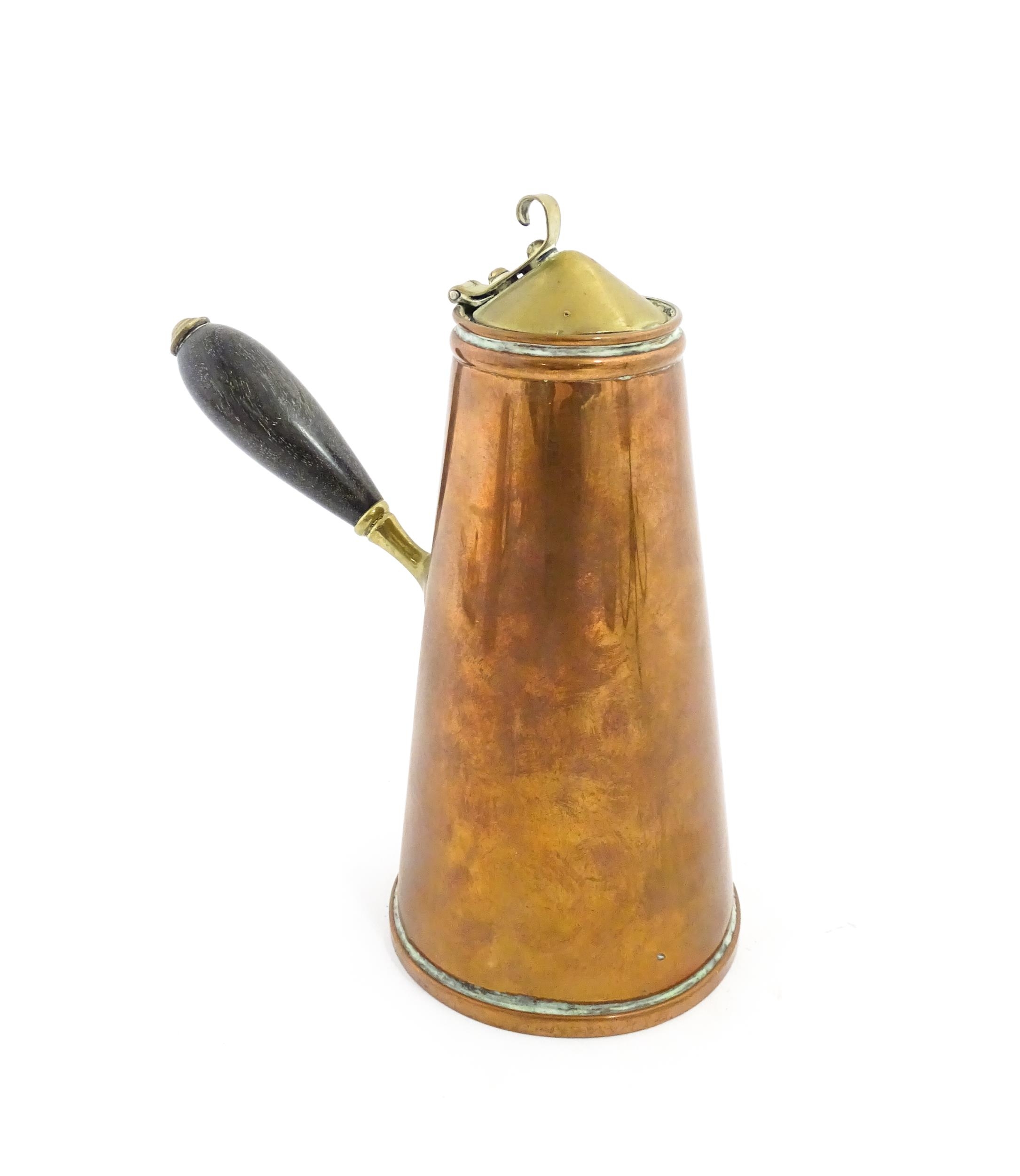 WAS Benson: An Arts & Crafts copper and brass insulated / jacketed hot water jug of tapering form,