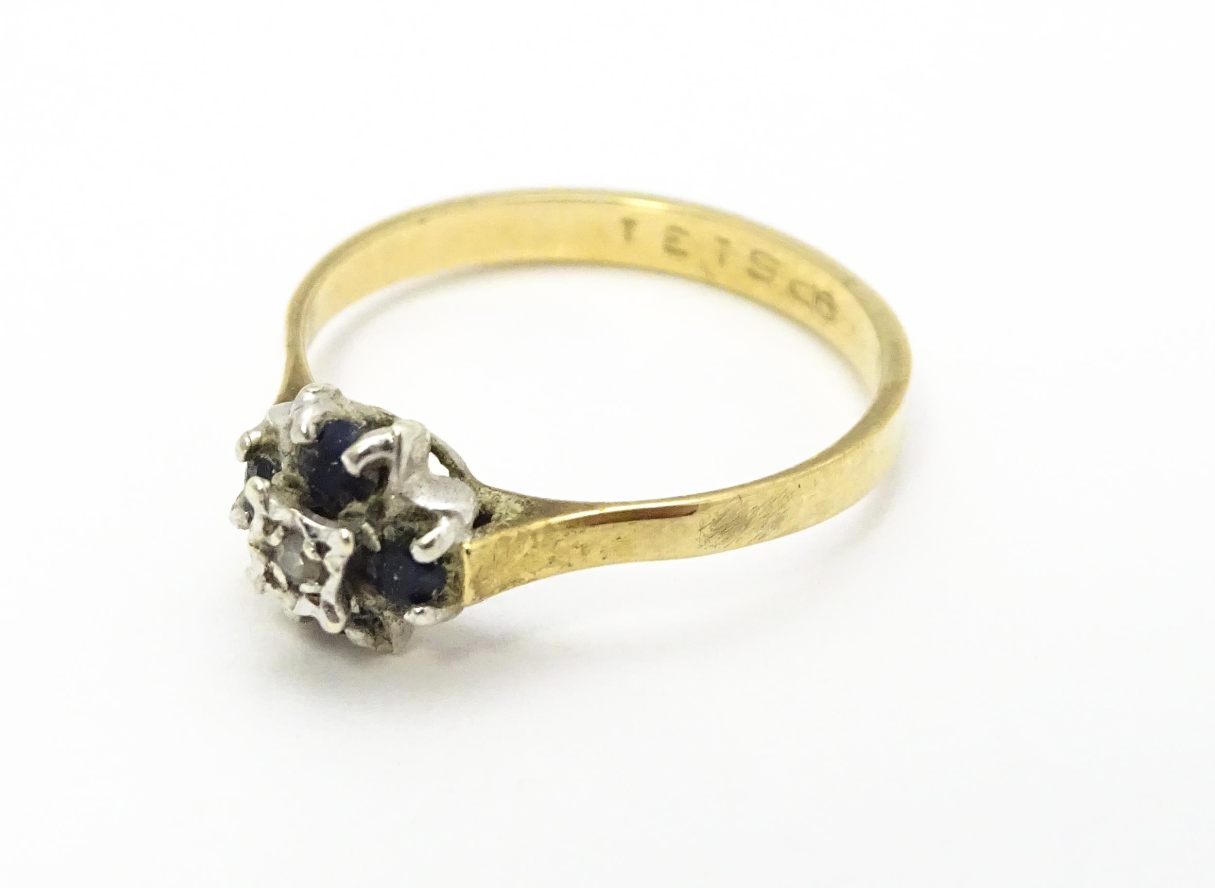 A 9ct gold ring set with diamonds and blue stones. Ring size approx. L Please Note - we do not - Image 3 of 7