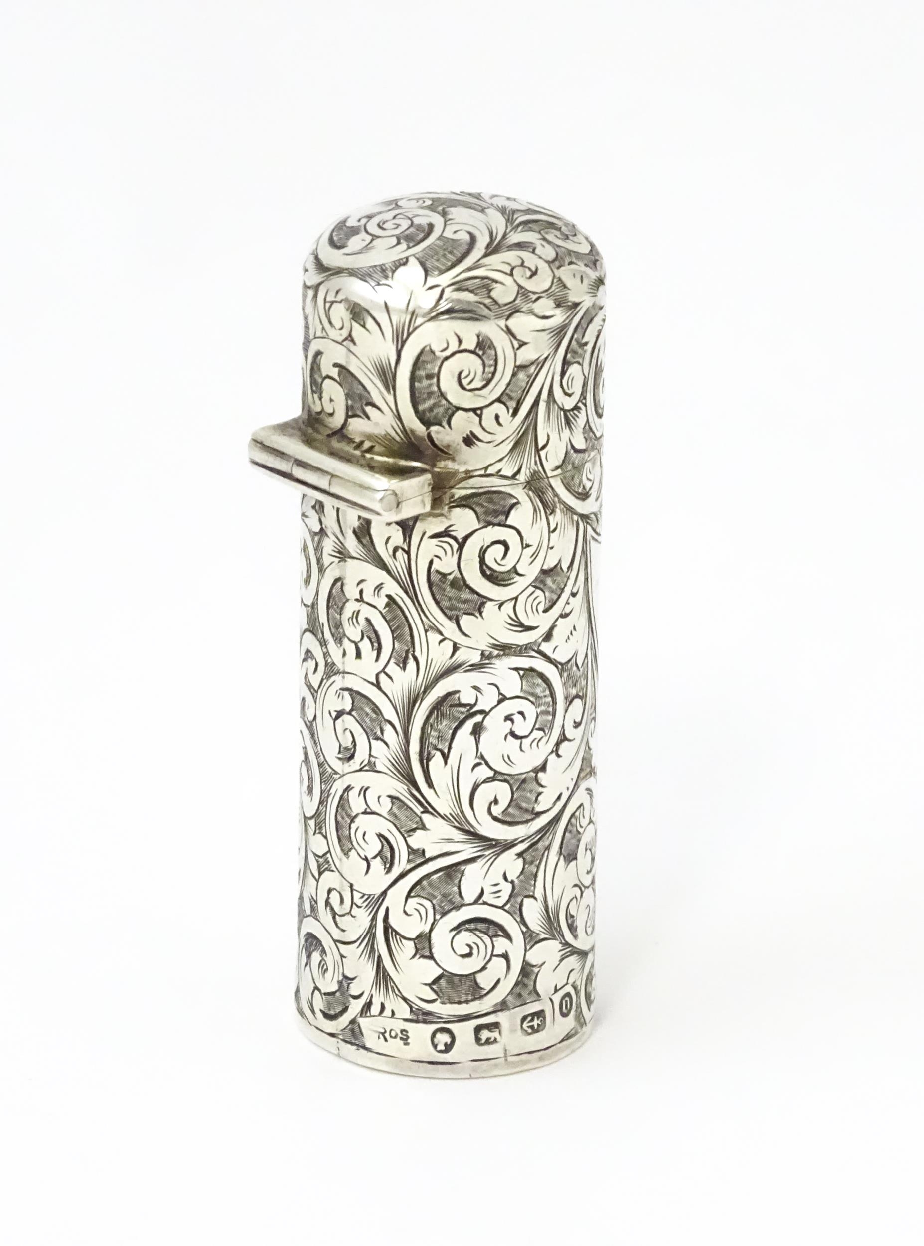 A silver scent / perfume bottle with engraved decoration opening to reveal gilded interior and - Image 3 of 9
