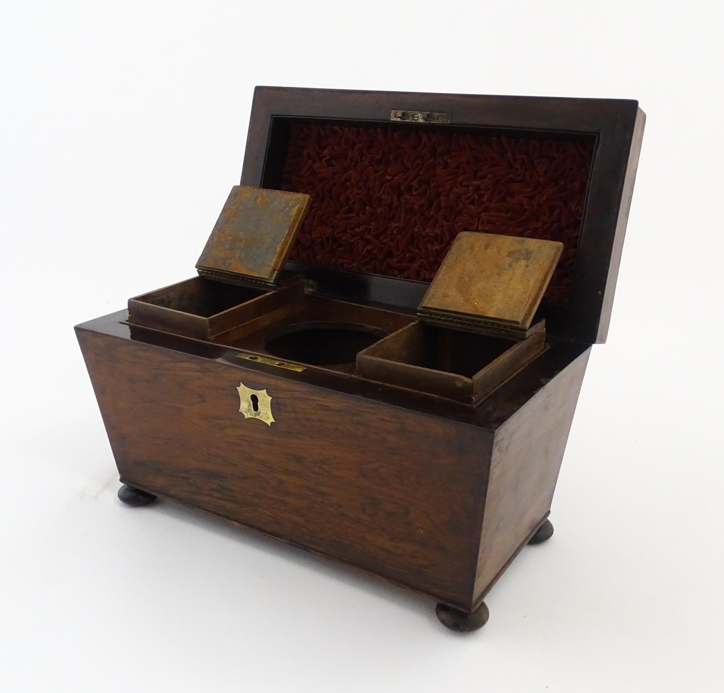 A 19thC rosewood tea caddy of sarcophagus form with four squat bun feet. The interior with two - Image 14 of 15