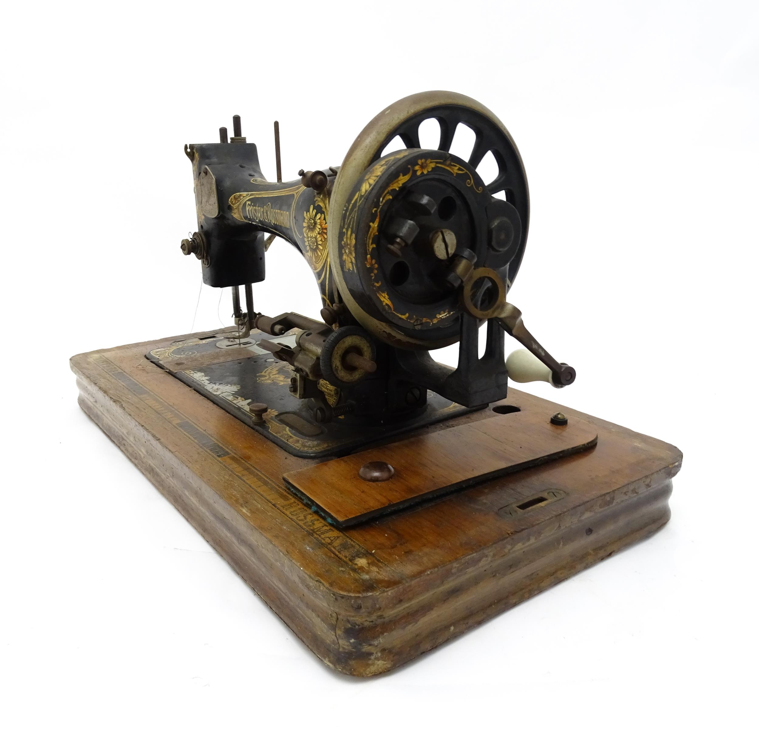 An early 20thC Frister & Rossmann hand crank sewing machine with floral and foliate decoration. - Image 4 of 15