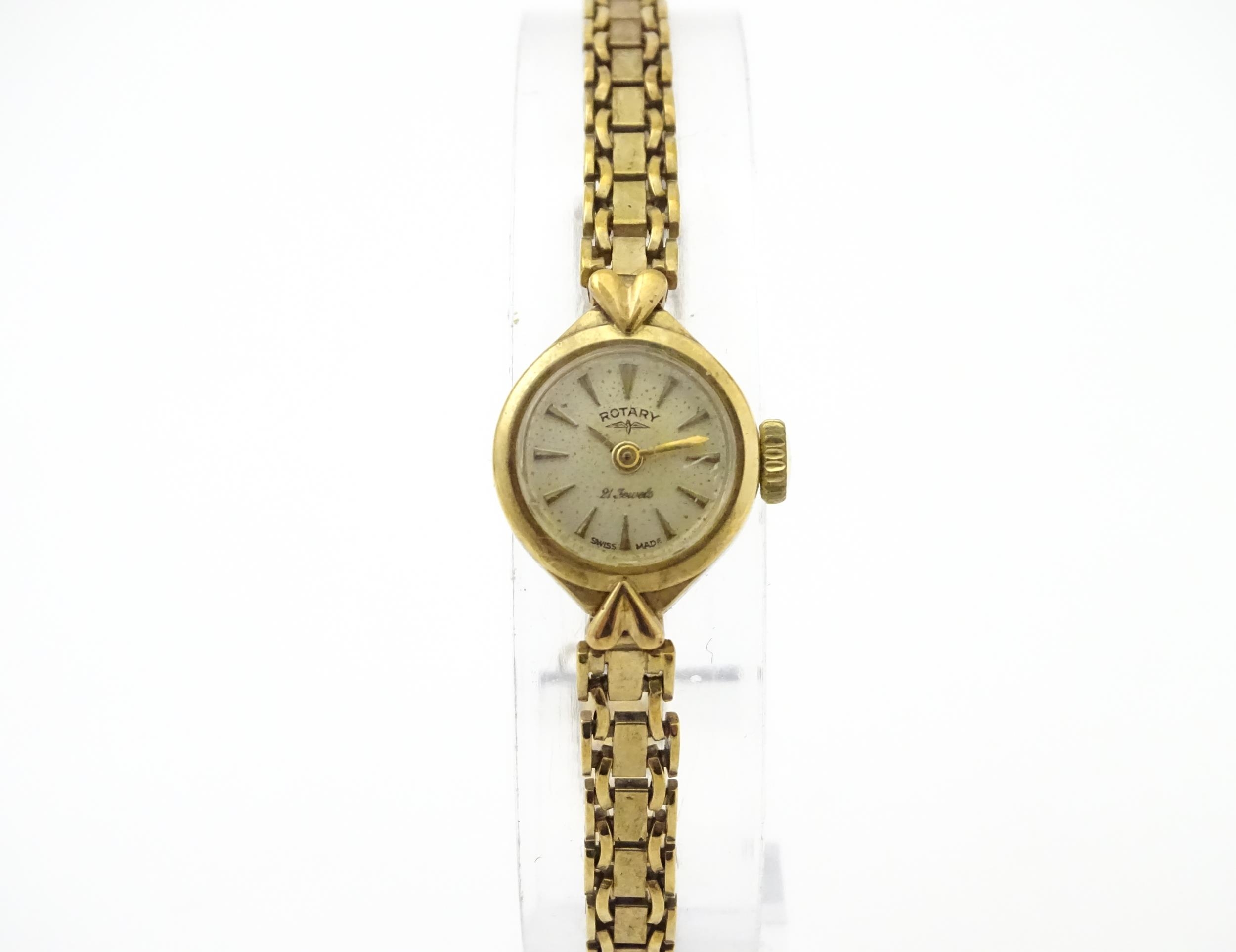 A 9ct gold cased ladies wristwatch by Rotary with 9ct gold bracelet strap . Approx 1/2" wide