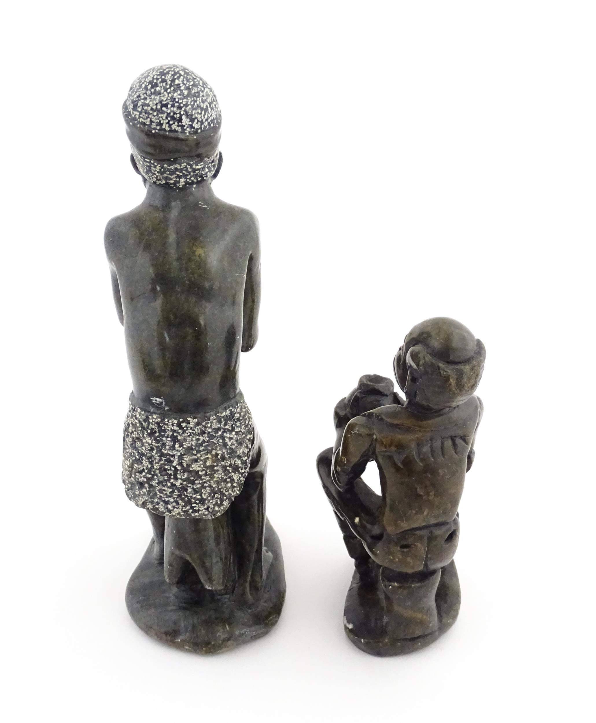 Ethnographic / Native / Tribal : An African soapstone carving modelled as a tribesman playing a - Image 4 of 6