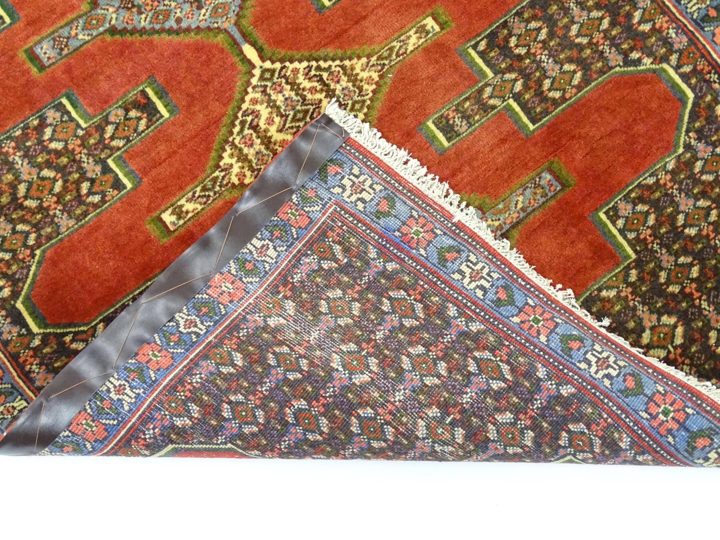 Carpet / Rug : A North West Persian Senneh runner with a red ground decorated with central repeating - Image 2 of 9