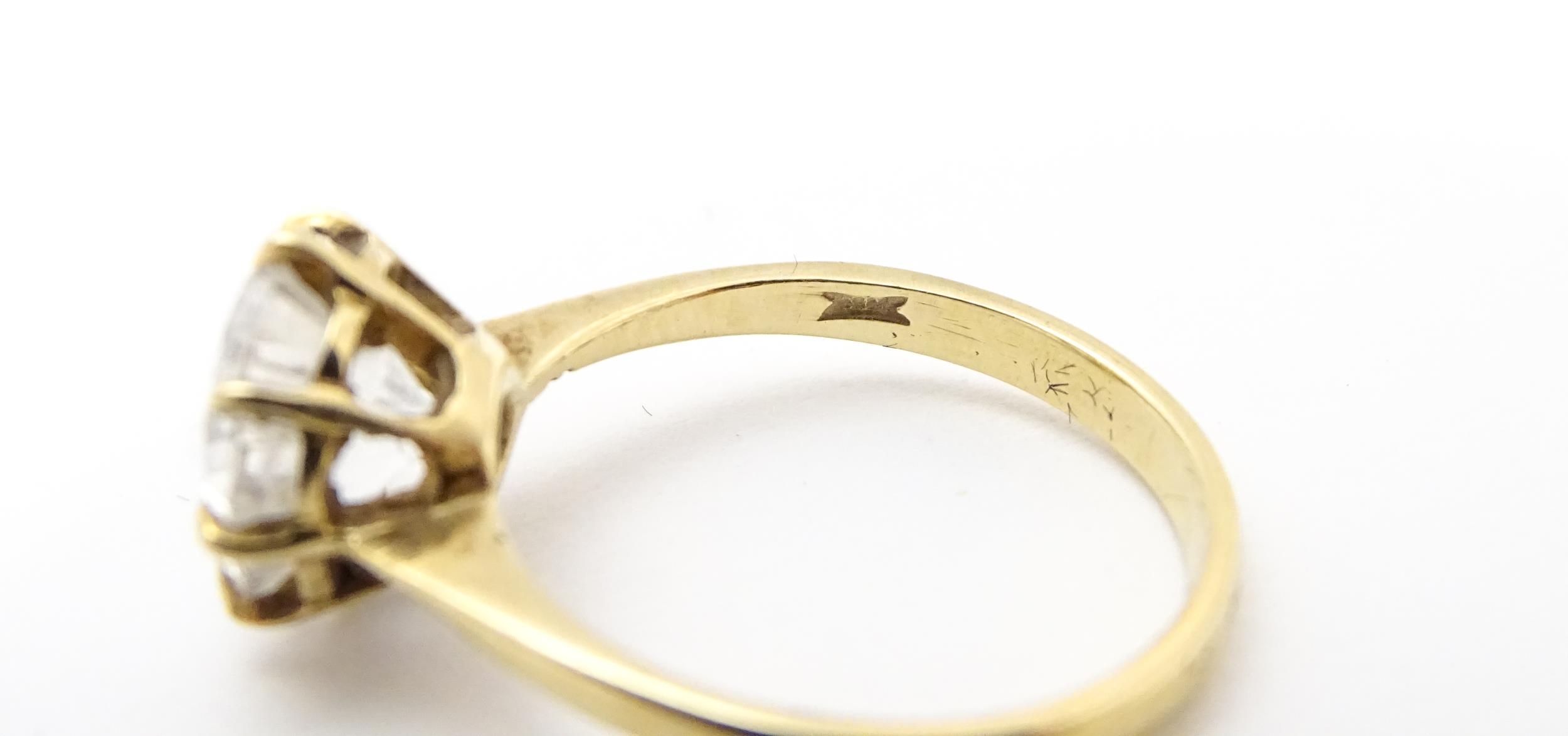 A 9ct gold ring set with a white stone solitaire. Ring size approx. O Please Note - we do not make - Image 6 of 7