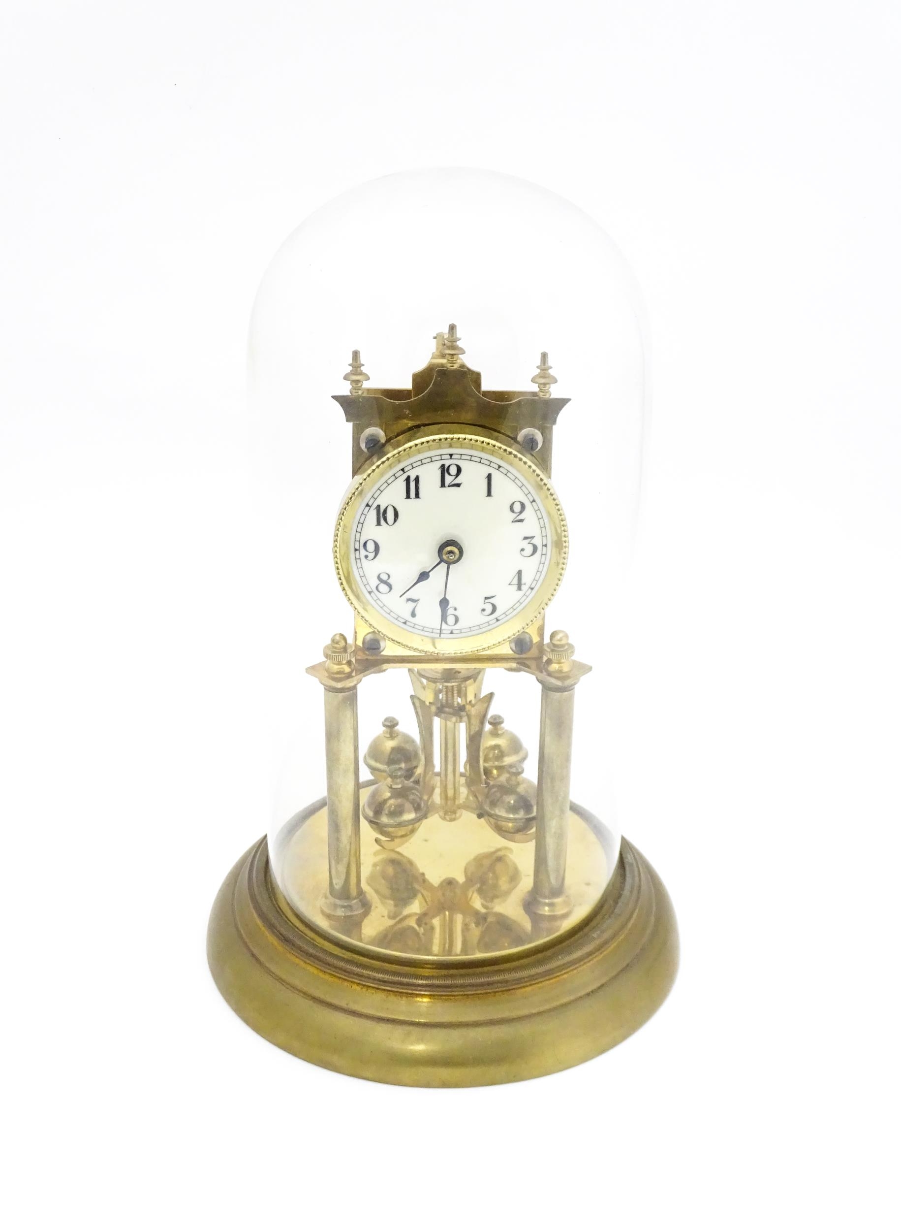 A 20thC anniversary / table clock with white enamel dial and Roman numerals. Under glass dome - Image 2 of 12