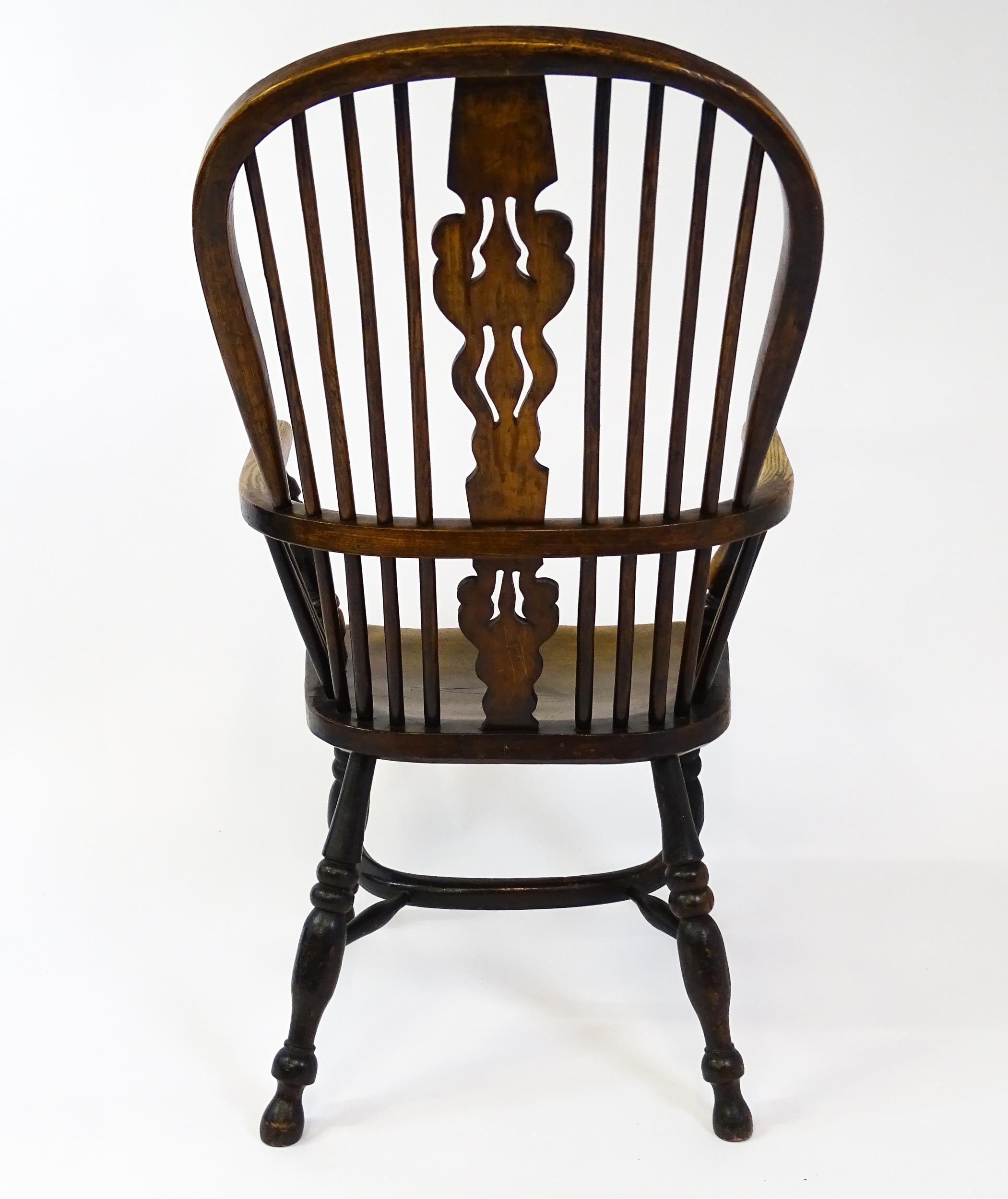 A mid 19thC ash and elm Windsor chair with a double bowed backrest and a pierced back splat above - Image 2 of 9