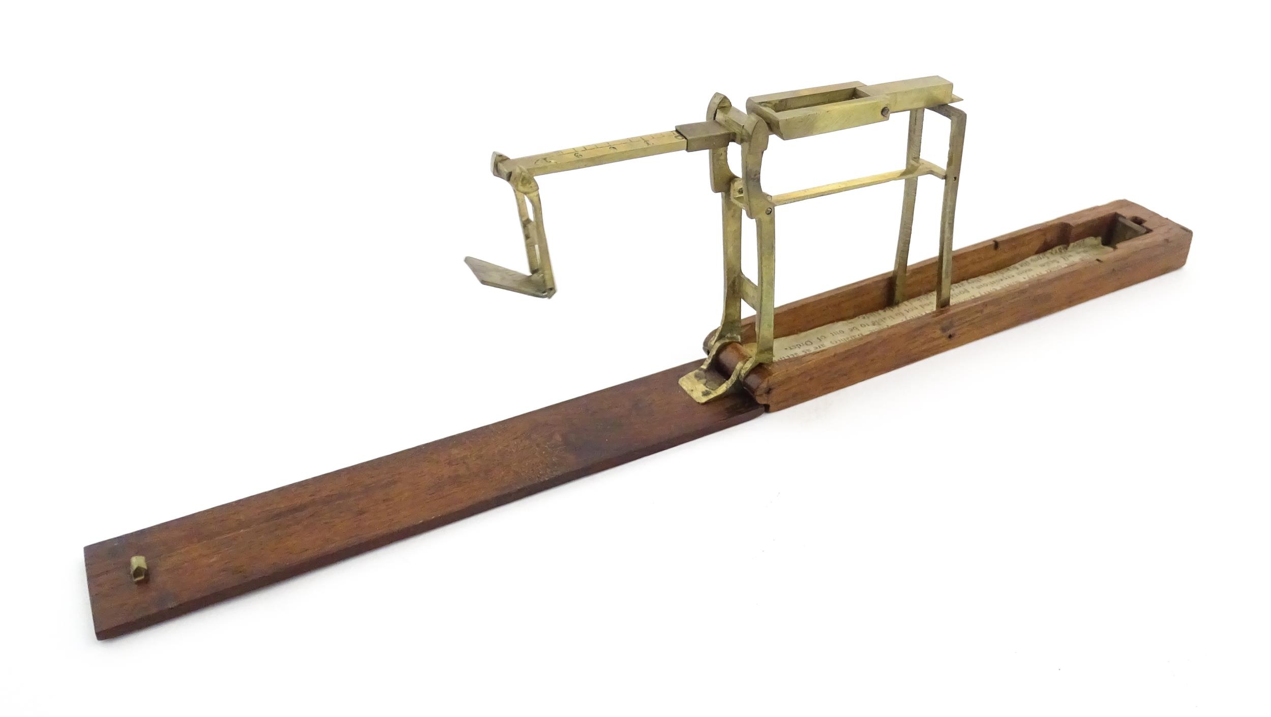 A 19thC mahogany cased brass folding guinea / coin scale. Case approx. 5 1/2" long Please Note - - Image 7 of 11