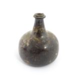 A late 18thC / early 19thC English dark olive green glass onion shape wine bottle. Approx. 6" high