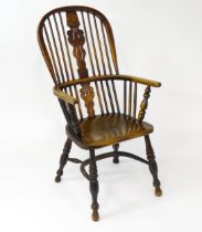 A mid 19thC ash and elm Windsor chair with a double bowed backrest and a pierced back splat above