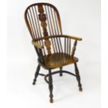 A mid 19thC ash and elm Windsor chair with a double bowed backrest and a pierced back splat above