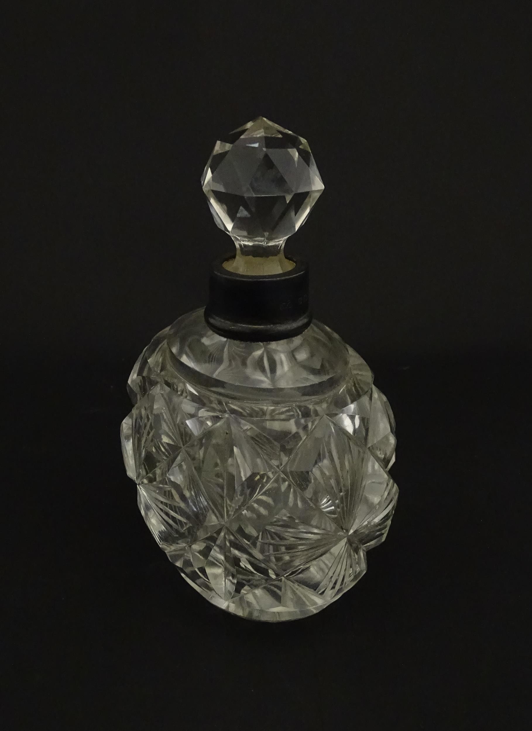 A cut glass scent / perfume bottle with silver top hallmarked London C.1933 . Approx. 5 1/4" high - Image 6 of 8