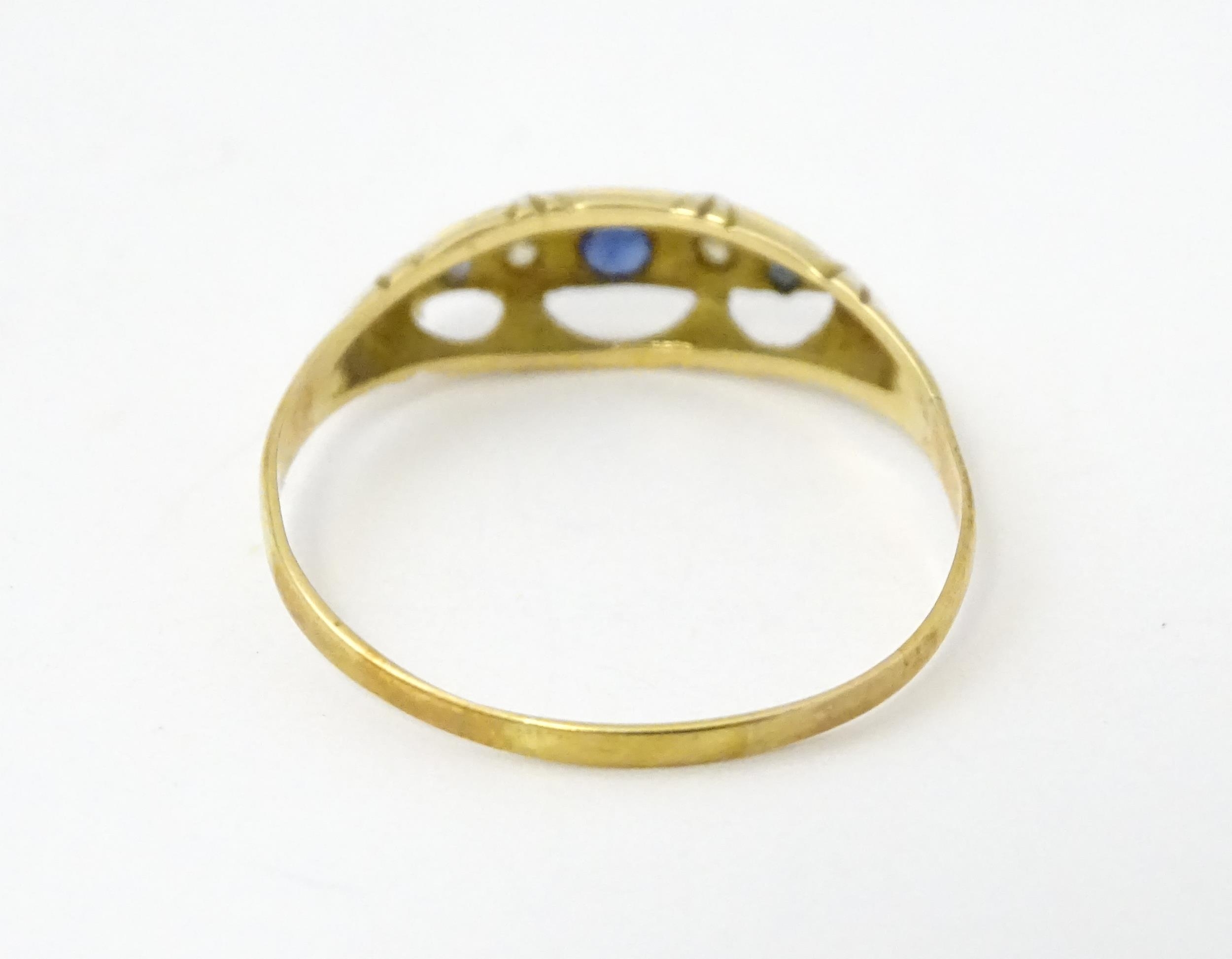 A gold ring set with diamonds and sapphires. Ring size approx. X Please Note - we do not make - Image 5 of 6