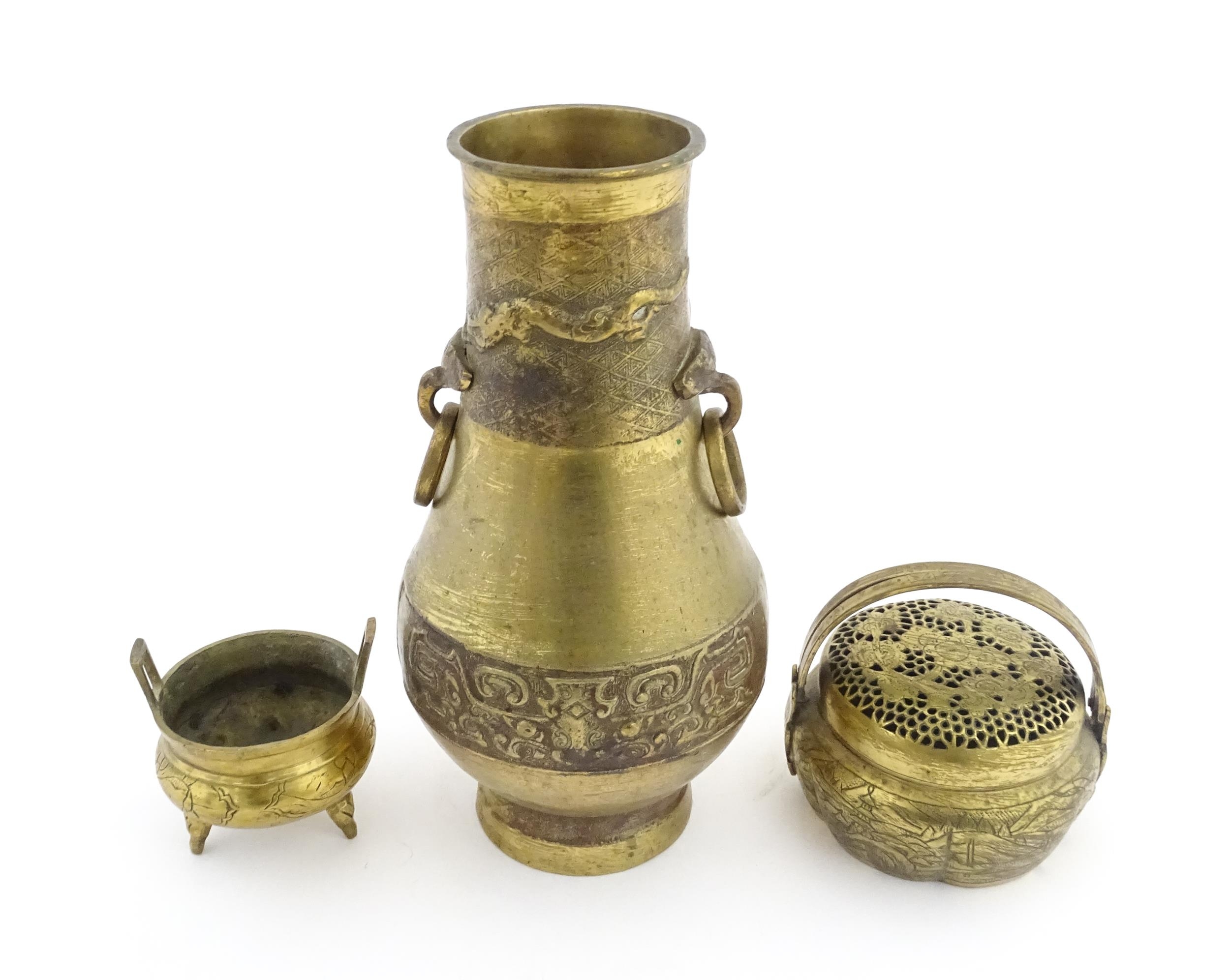 Three items of Chinese brass ware to include a baluster vase with twin ring handles decorated with - Image 6 of 9