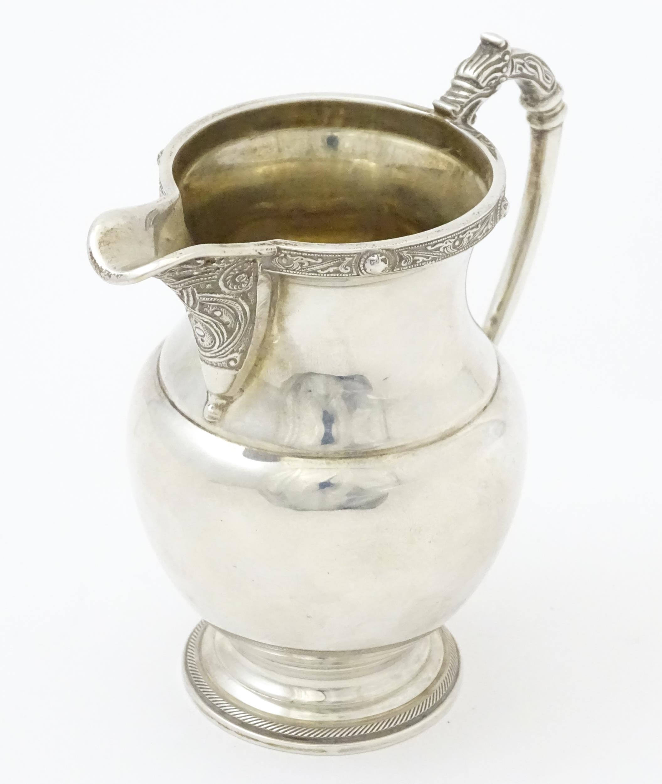 A three piece silver tea set comprising teapot, hot water pot and cream jug, with Celtic style - Image 16 of 20