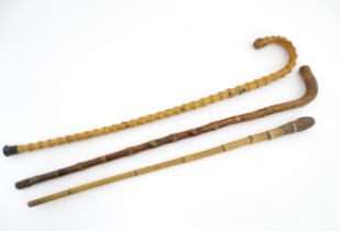 Three assorted walking sticks / canes to include an example with Oriental character marks and scene.
