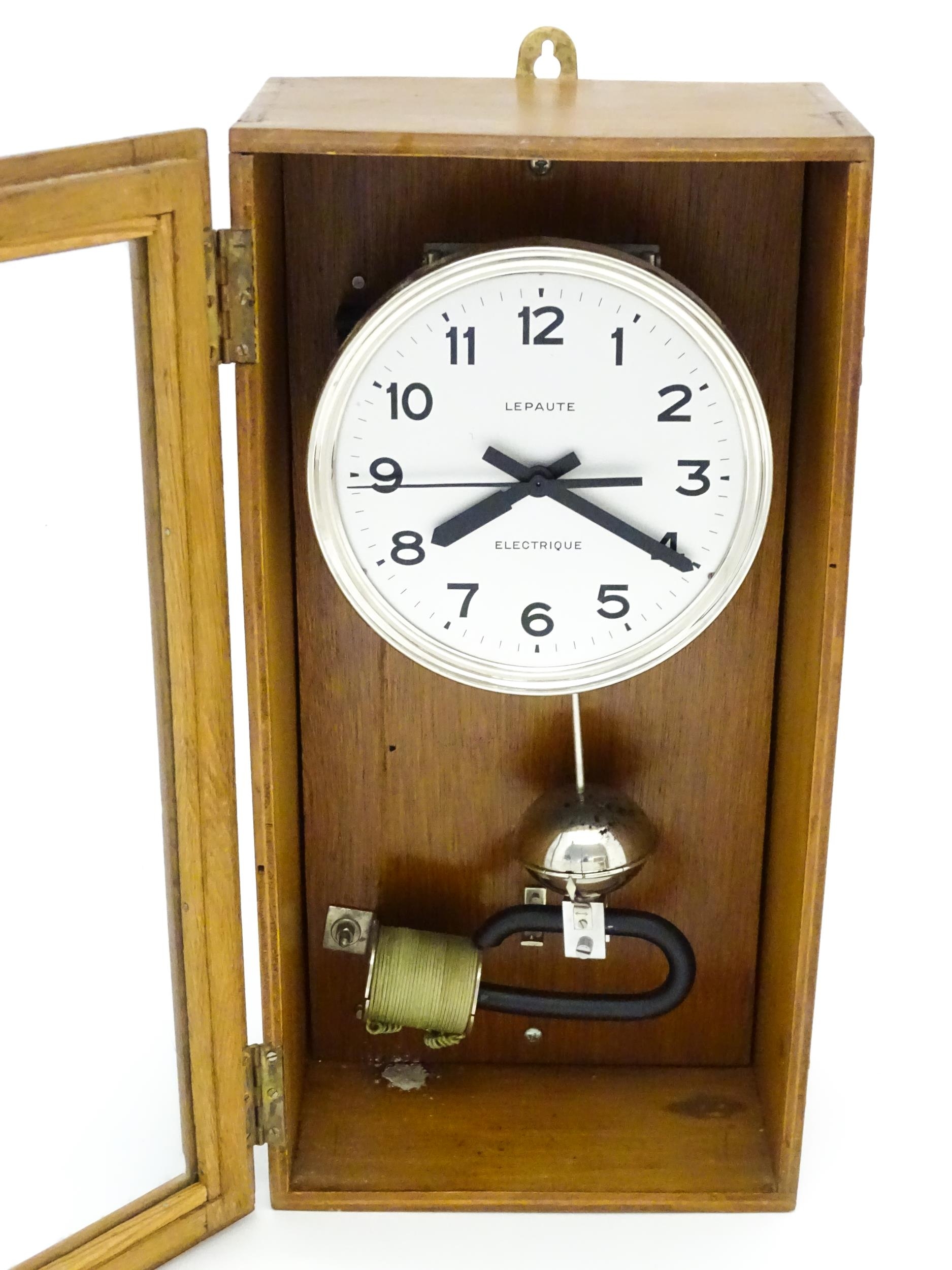 Lepaute : An early 20thC oak cased electric clock. The white dial with Arabic numerals signed - Image 5 of 6