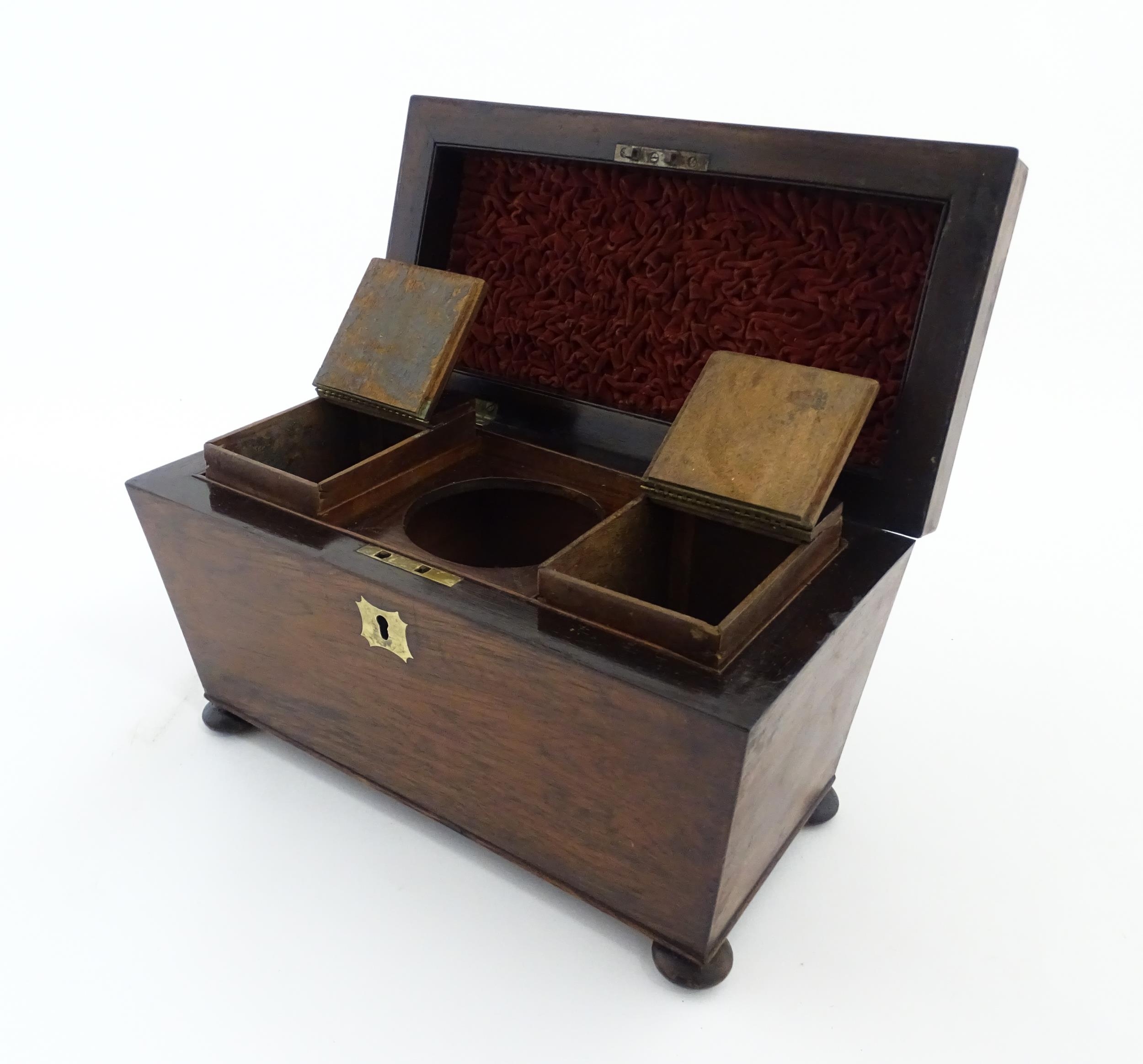 A 19thC rosewood tea caddy of sarcophagus form with four squat bun feet. The interior with two - Image 15 of 15