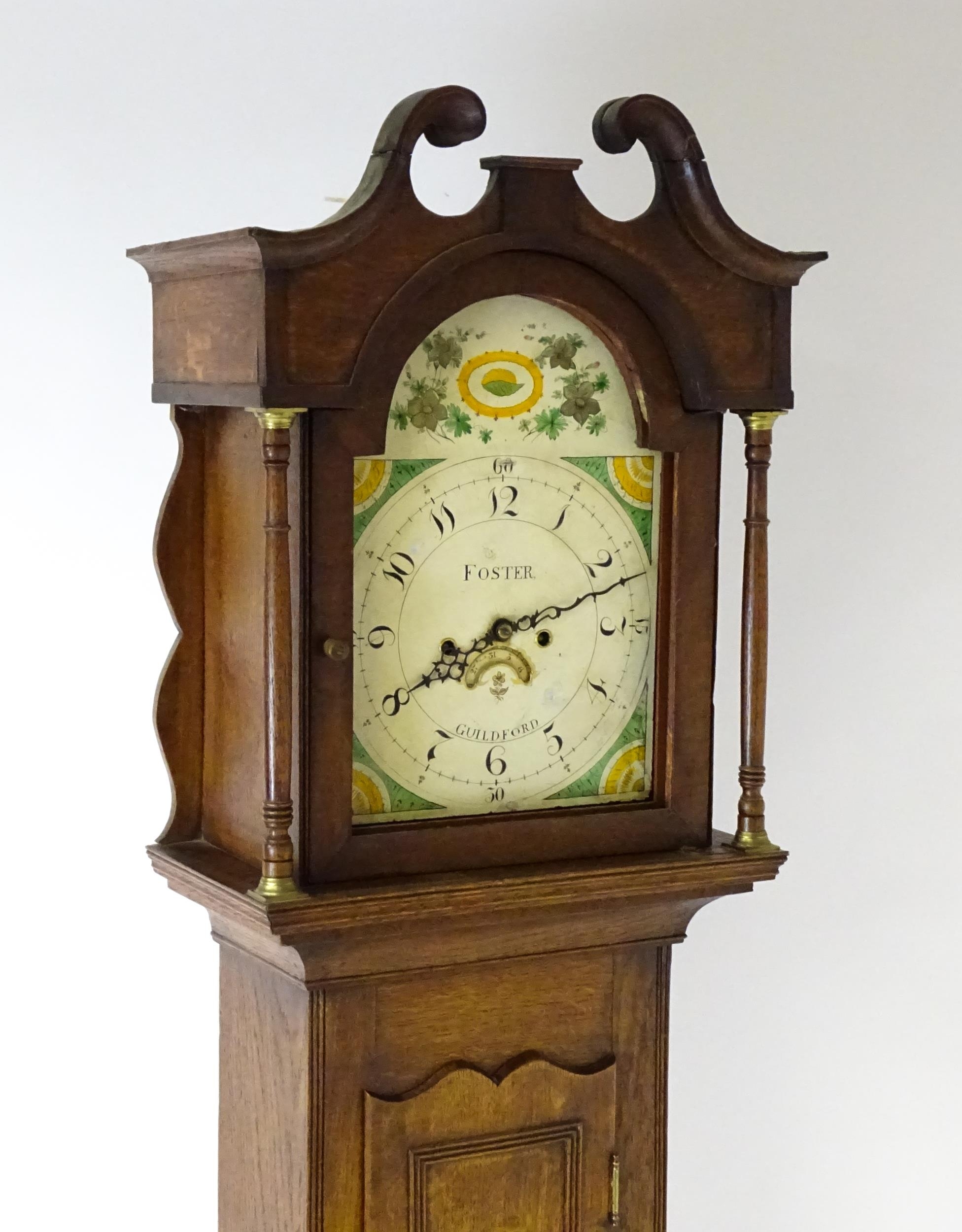 A 19thC oak cased 8-day longcase clock. The painted arch dial signed Foster Guildford. The case with - Image 3 of 10