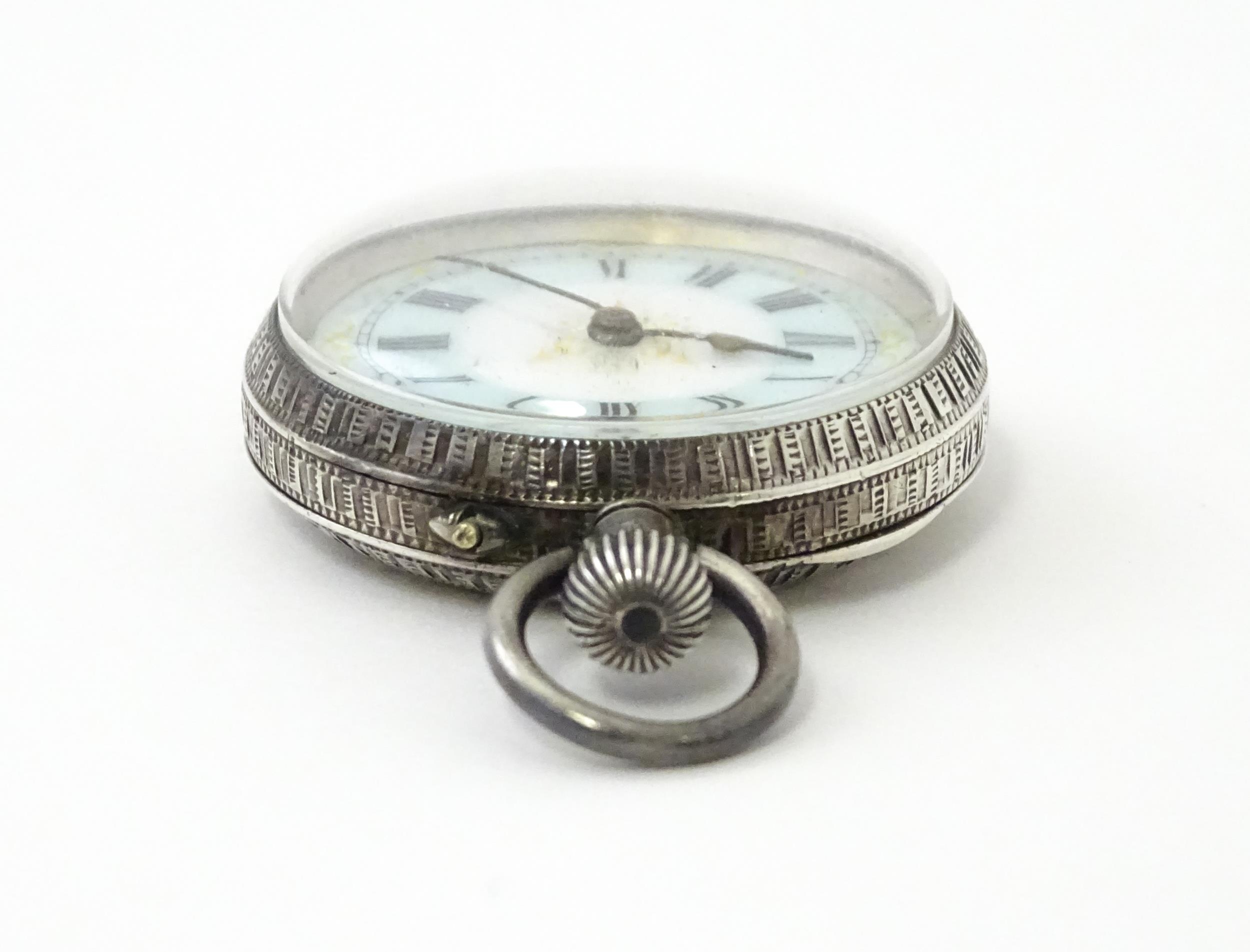 A Swiss silver cased pocket / fob watch with enamel detail and Roman Numerals. Approx 1 /4" wide - Image 6 of 11