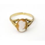 A 9ct gold ring set with classical cameo . Ring size approx. T Please Note - we do not make