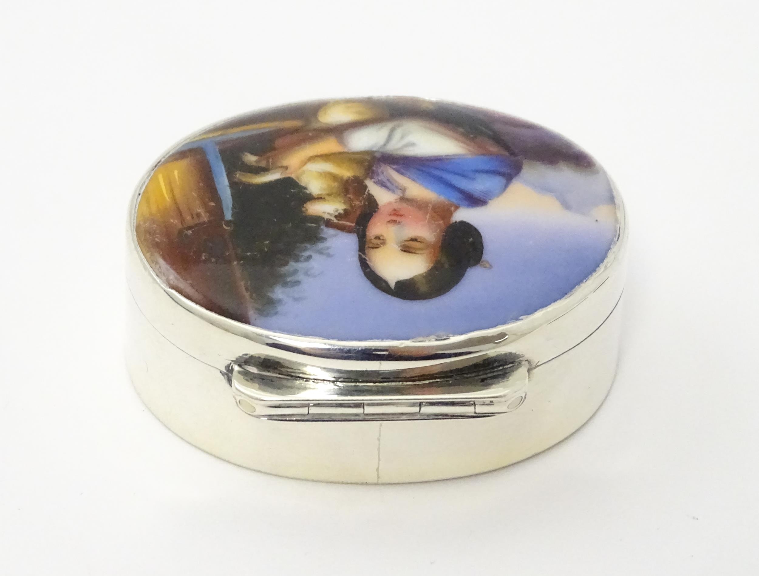 A silver pill box with gilded interior and ceramic cabochon to lid depicting a young girl holding - Image 6 of 9