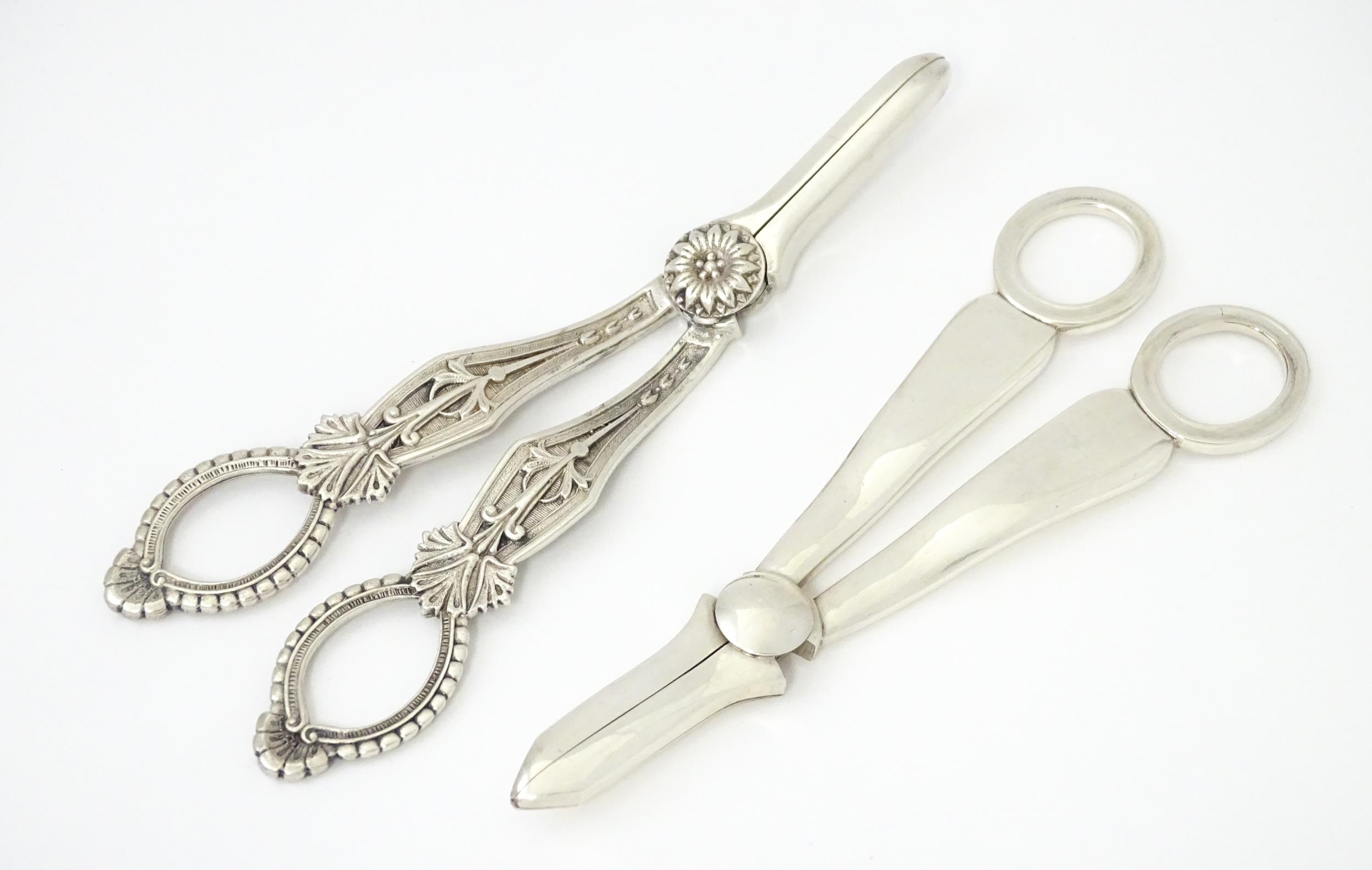 Two silver plate grape scissors / shears. Approx 6 1/2" long Please Note - we do not make