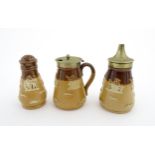 A Royal Doulton two tone stoneware three piece cruet set comprising salt, pepper and mustard,