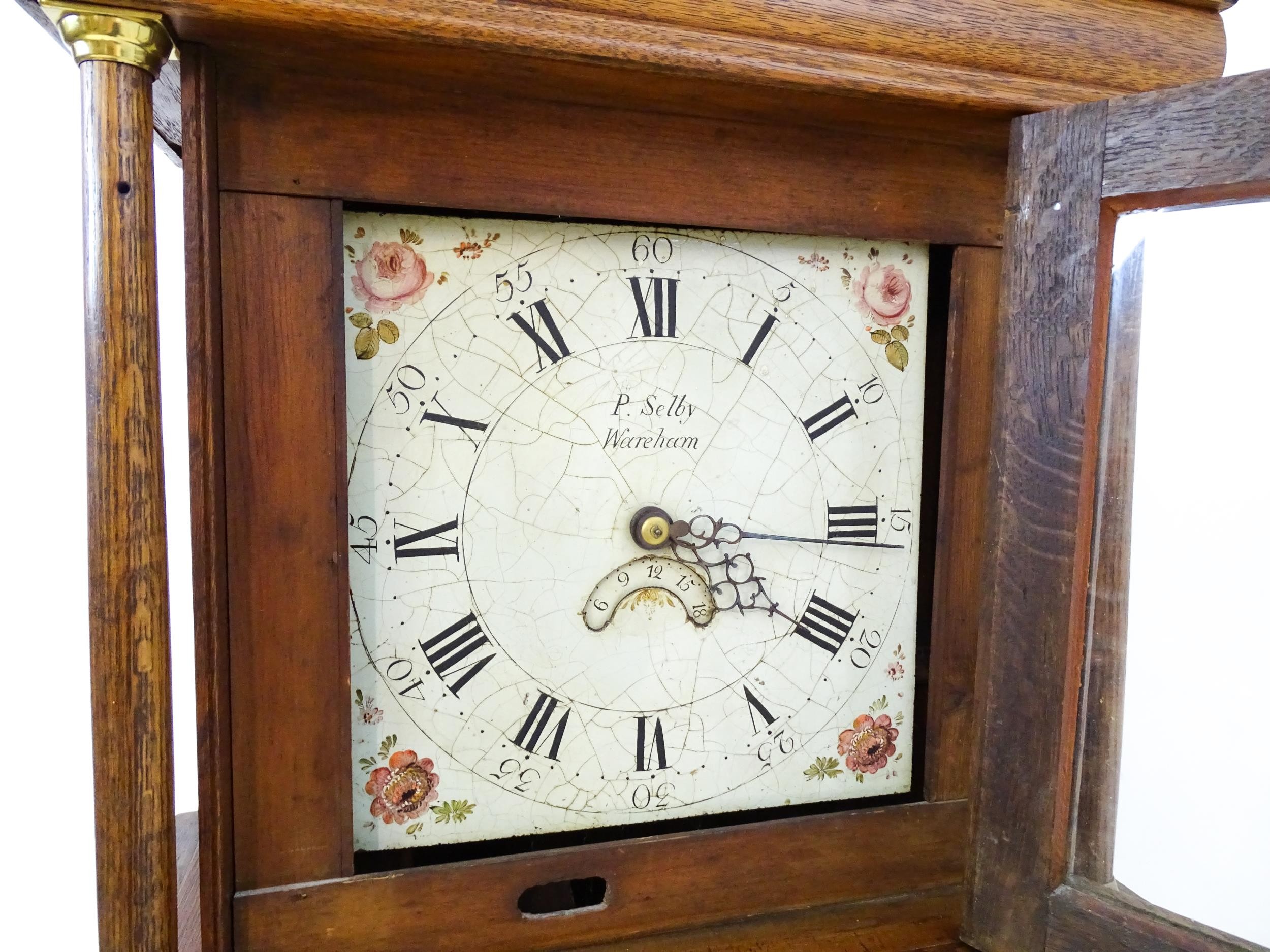 P Selby Wareham - Dorset : A late 18thC oak cased 30 hour longcase clock, the painted dial signed P. - Image 8 of 12