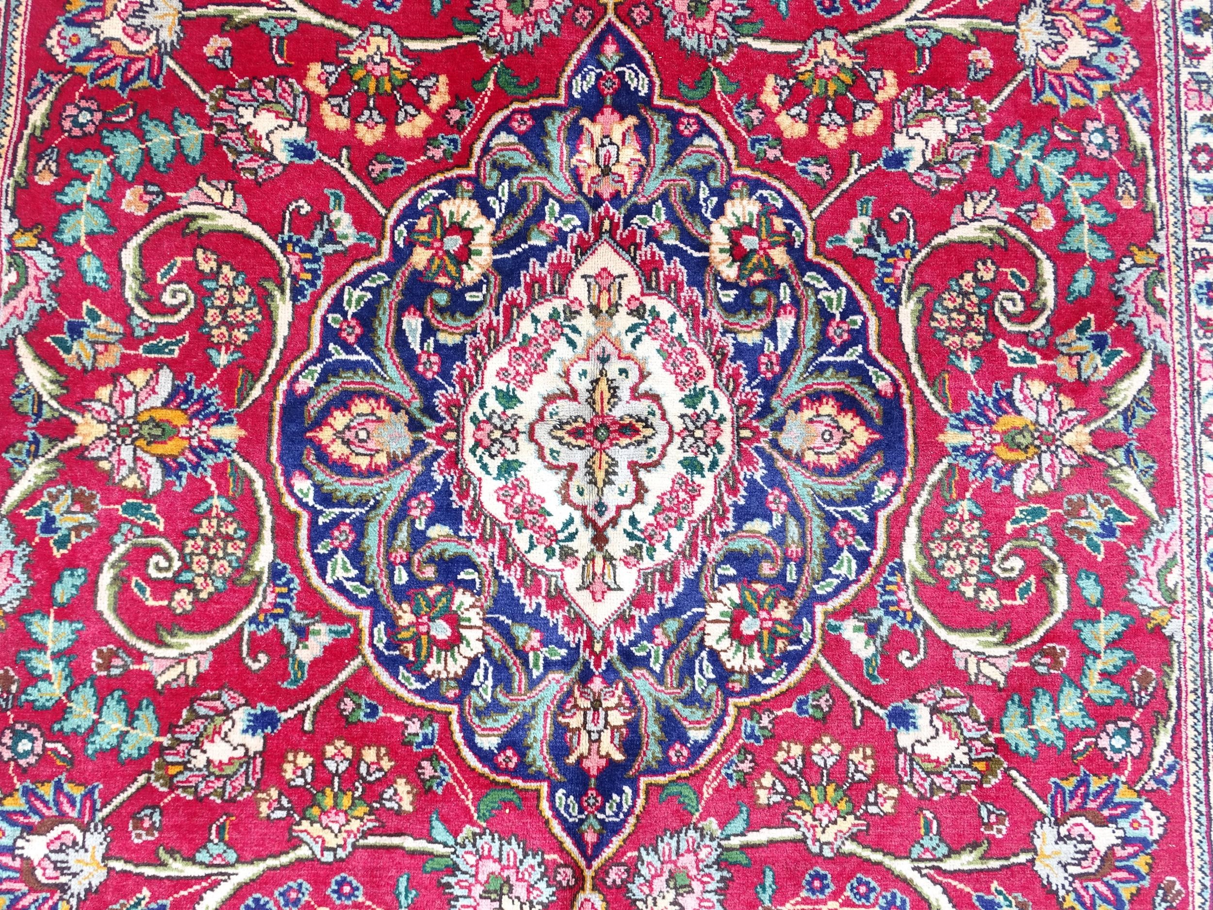 Carpet / Rug: A North West Persian Tabriz carpet the red ground with central cream and blue - Image 7 of 11