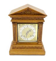 A 19thC German oak cased mantle clock by Winterhalder & Hofmeier, having a silvered chapter ring,