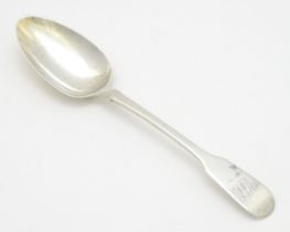 A silver Fiddle pattern table spoon hallmarked London 1818, maker Richard Poulden. Approx. 8 1/2"