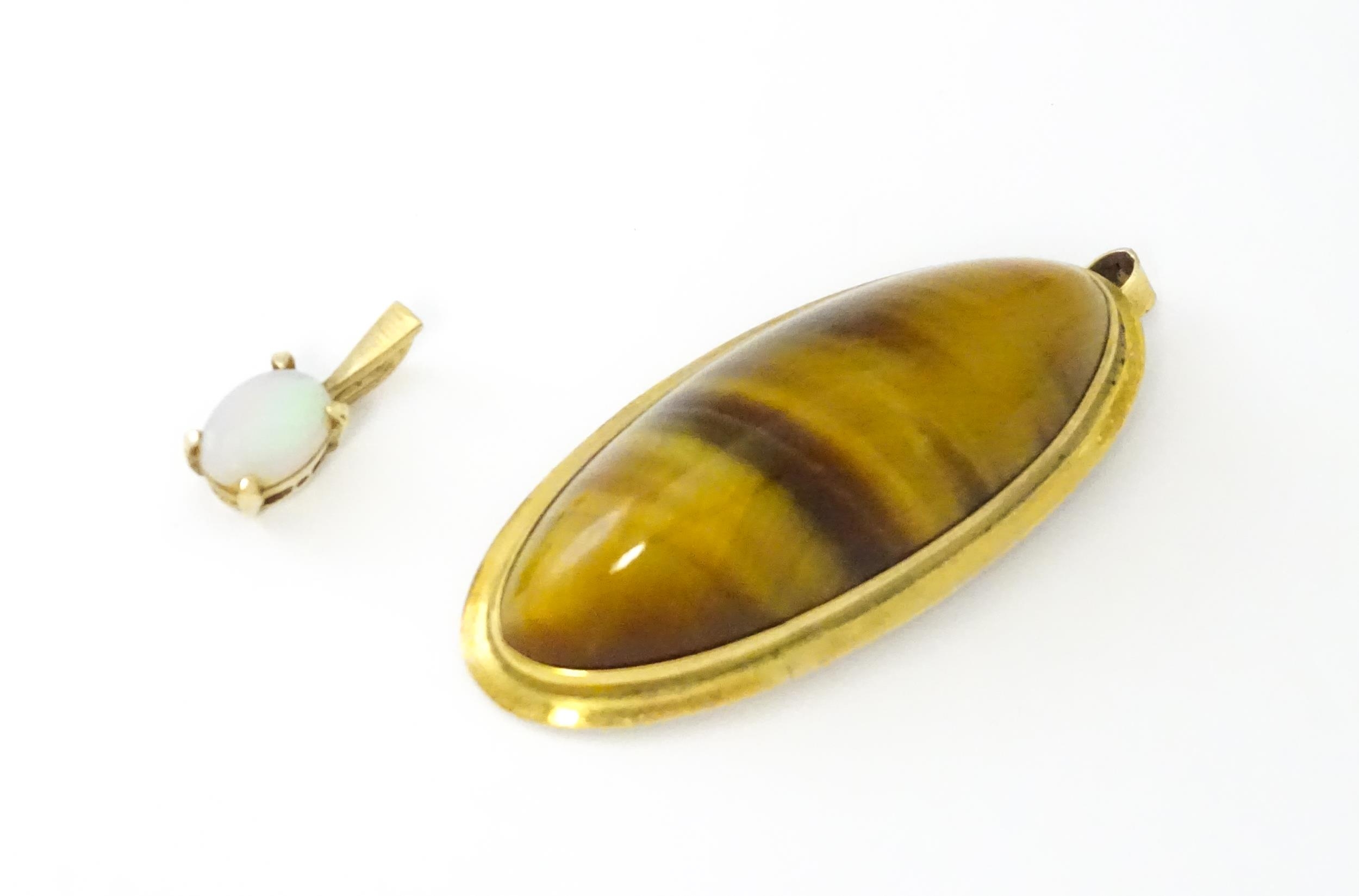 A 9ct gold pendant set with opal together with a pendant set with tigers eye cabochon. Approx 1 1/2" - Image 3 of 9