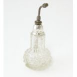 A glass atomiser with silver top. Marked Sterling Silver . Approx. 5 1/2" Please Note - we do not