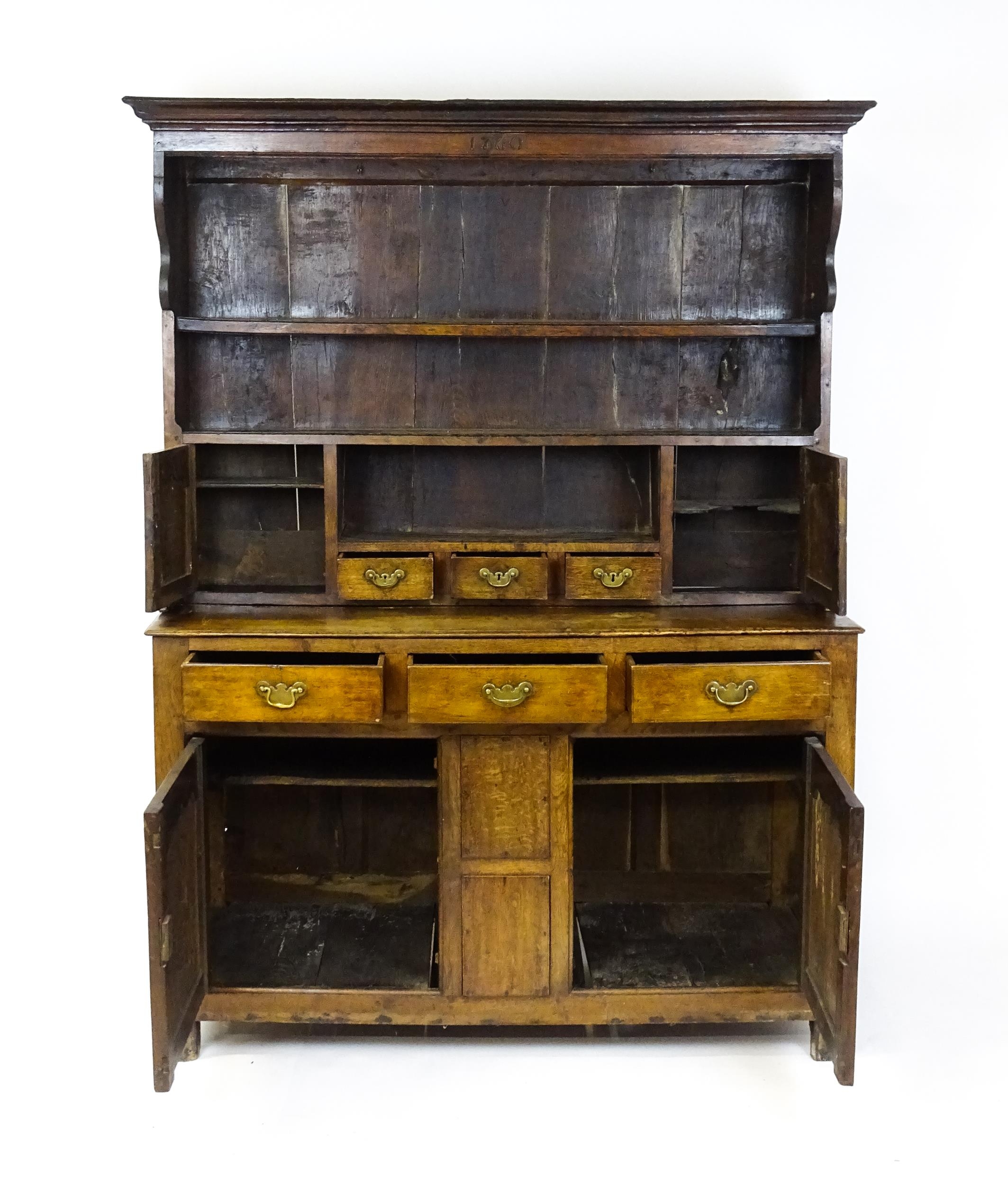 A mid 18thC oak dresser with a moulded cornice above three graduated shelves flanked by panelled - Image 7 of 9