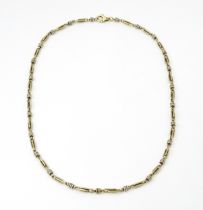 A silver and silver gilt necklace. Approx. 20" long Please Note - we do not make reference to the