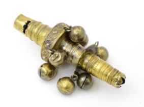 A George III silver gilt child's teething whistle / rattle. Hallmarked London 1815. Approx 3 1/2"
