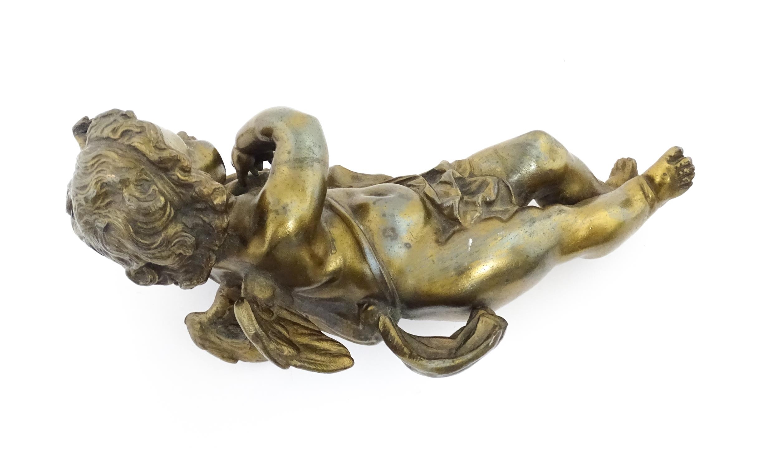 A 20thC cast model of a winged putto / cherub. Approx. 11" long Please Note - we do not make - Image 6 of 6