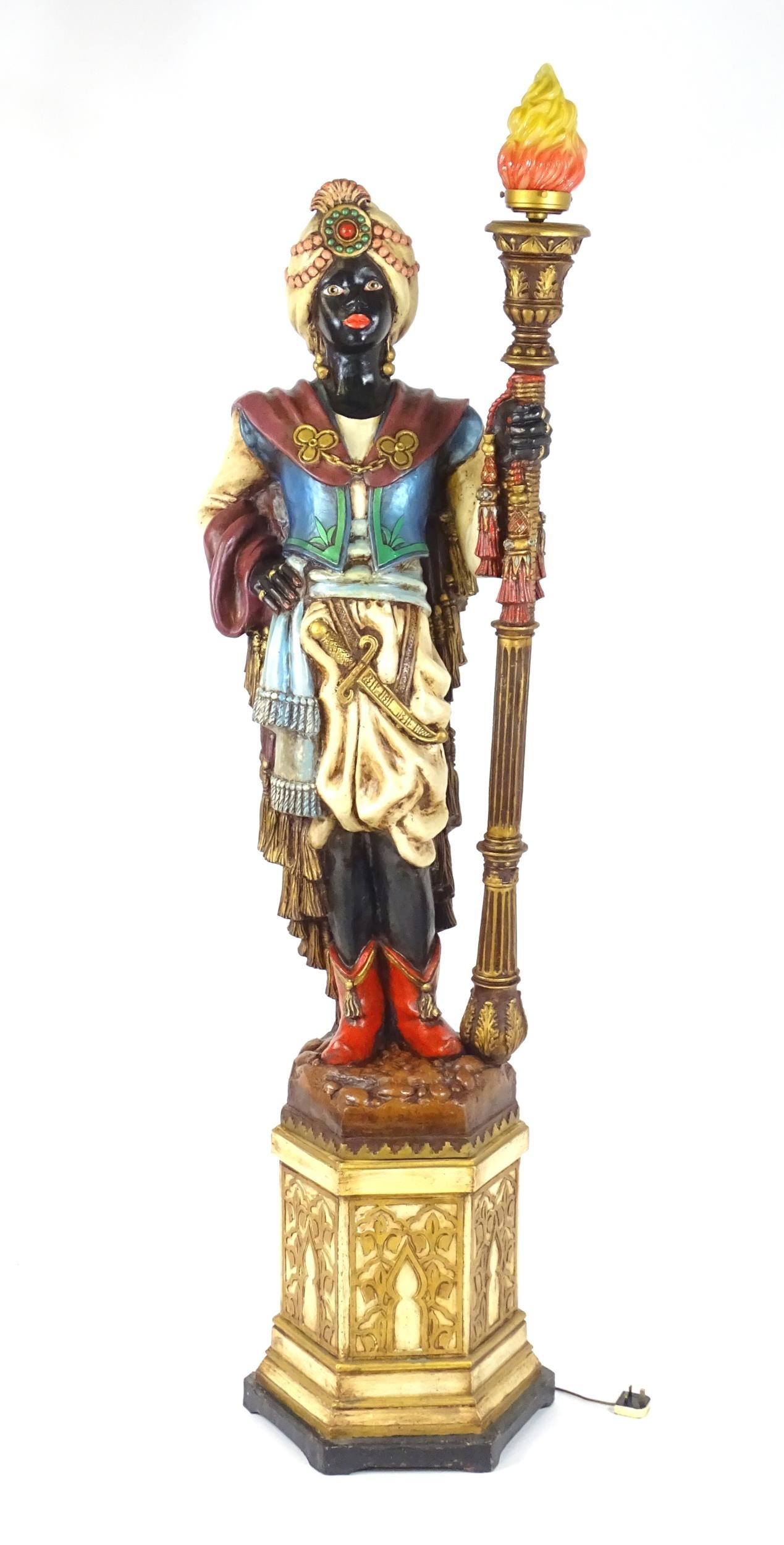 A mid 20thC blackamoor lamp, the lamp having a polychrome figural top grasping a torchiere, the - Image 14 of 14