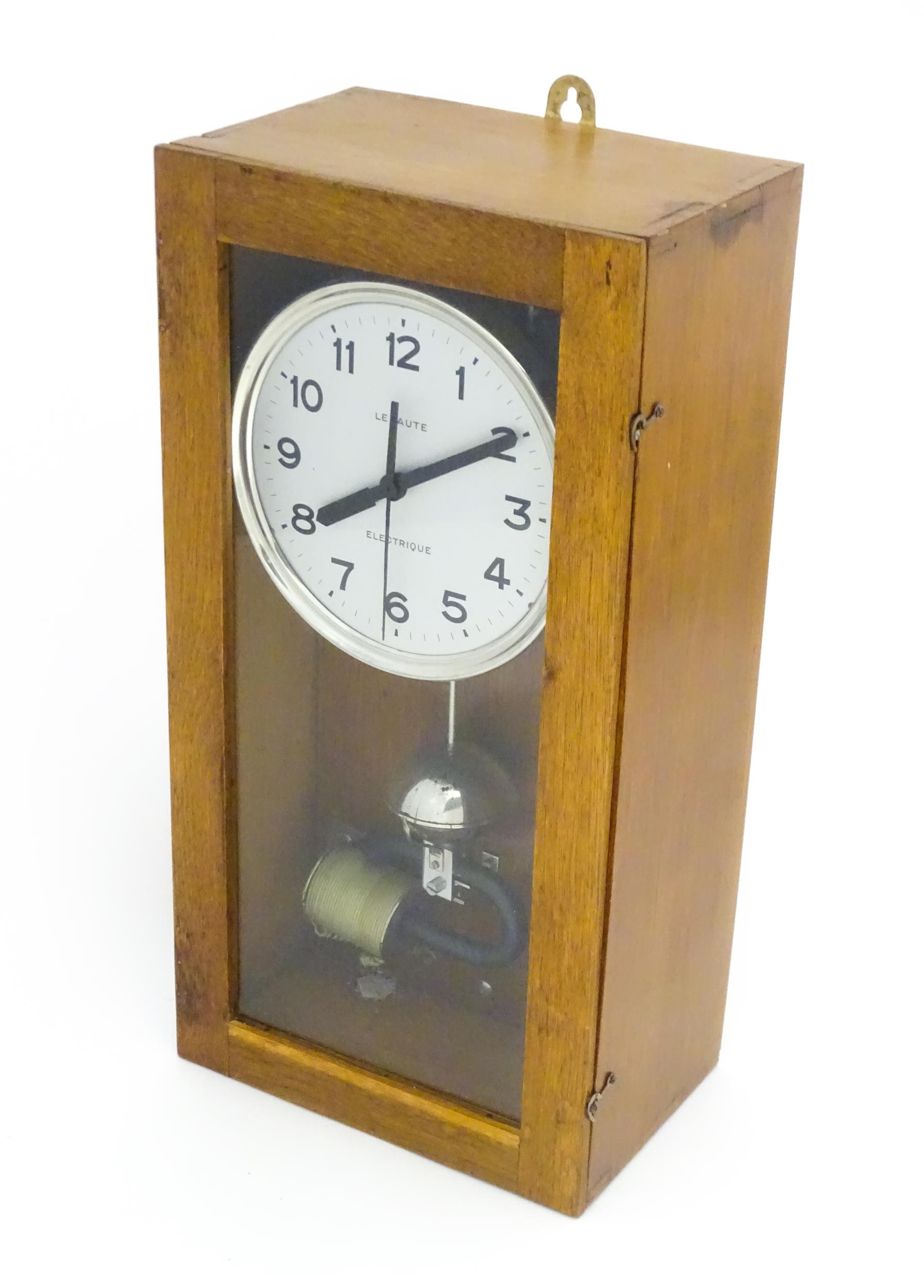 Lepaute : An early 20thC oak cased electric clock. The white dial with Arabic numerals signed - Image 3 of 6