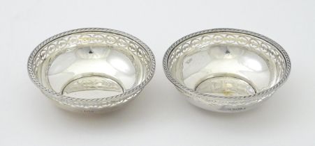 A pair of silver bon bon dishes hallmarked Sheffield 1932, maker Walker & Hall. Approx. 4"