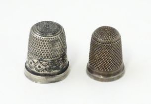 Two silver thimbles, one marked Sterling Silver, maker Charles Horner, the other small / child's